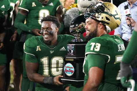 Brown tosses 3 TD passes to lead USF to a 45-0 rout of undermanned Syracuse in Boca Raton Bowl